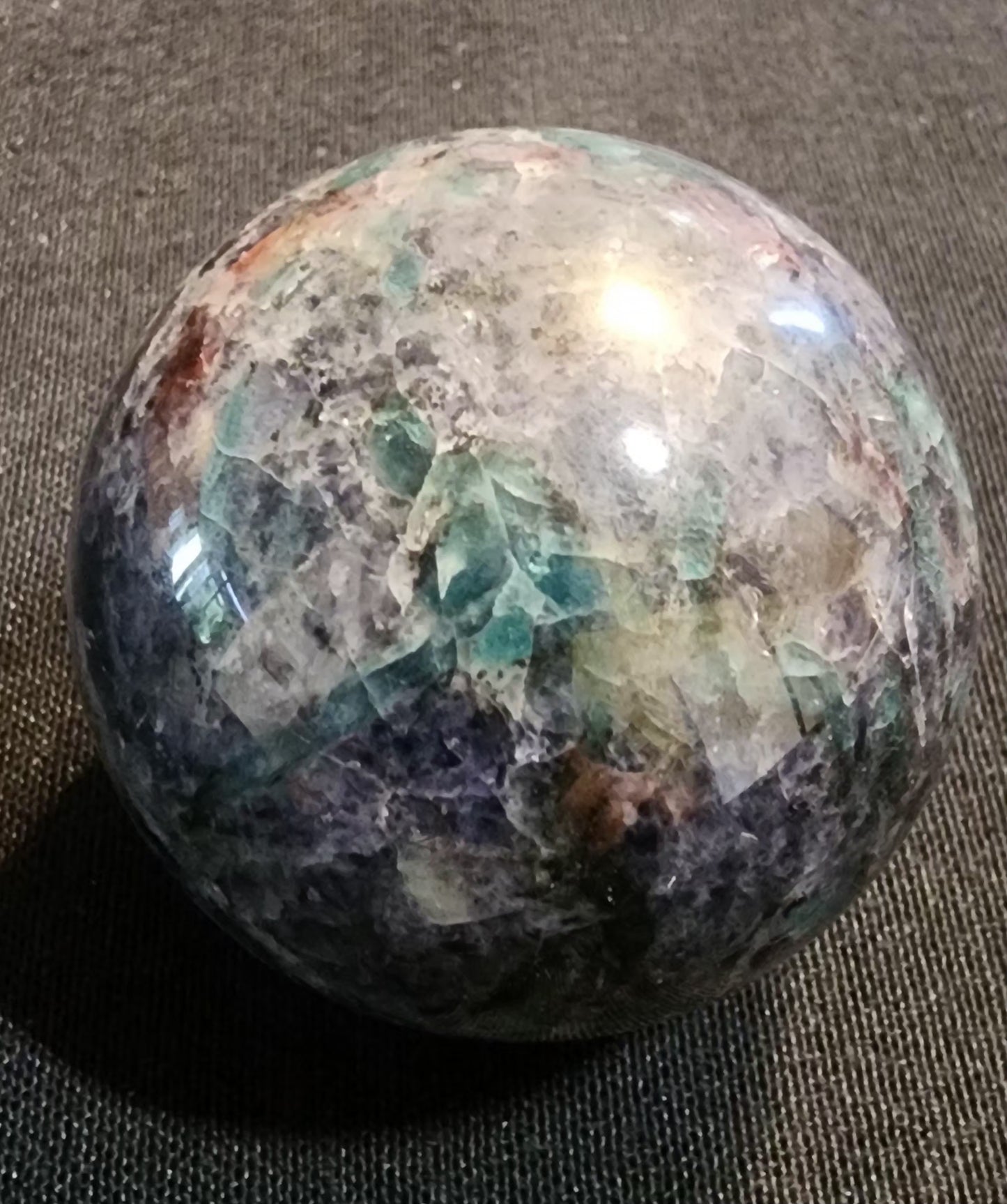 Cordierite sphere with Emerald