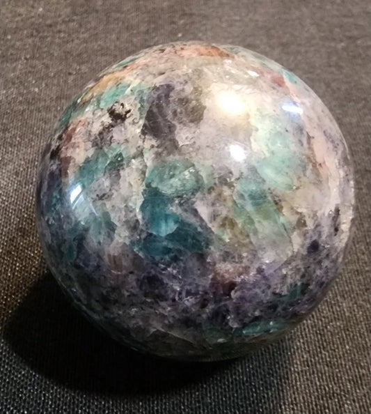 Cordierite sphere with Emerald
