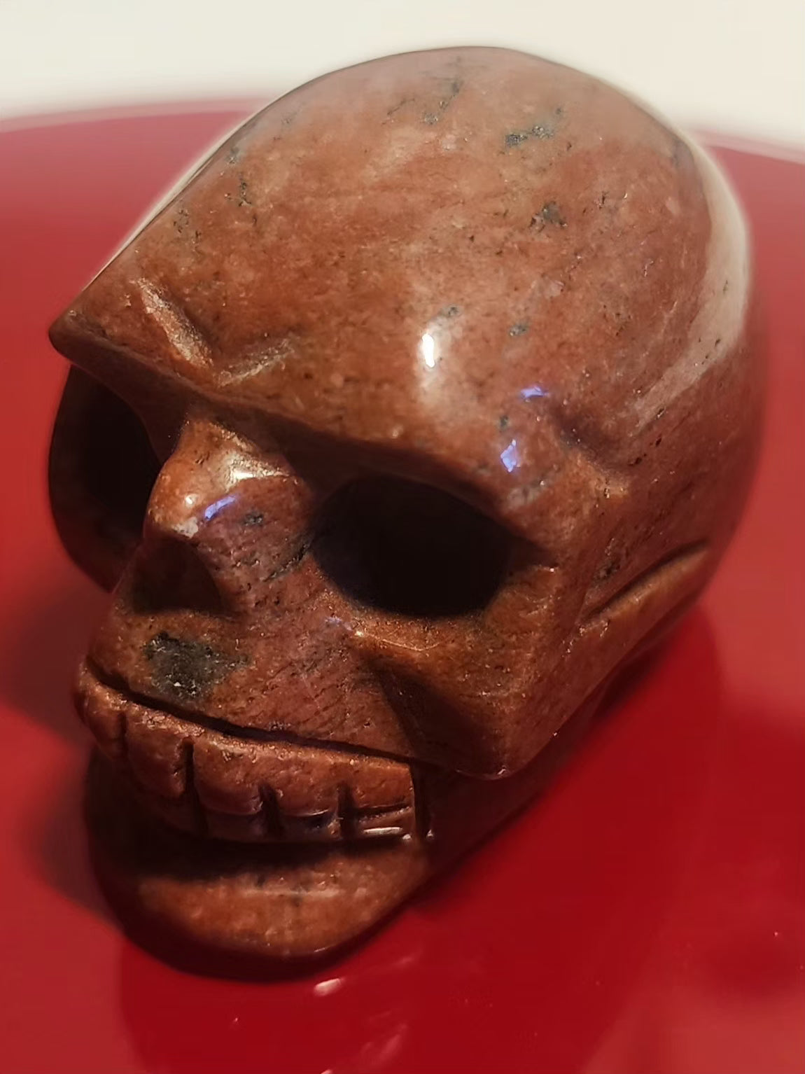 Red Jasper skull carving