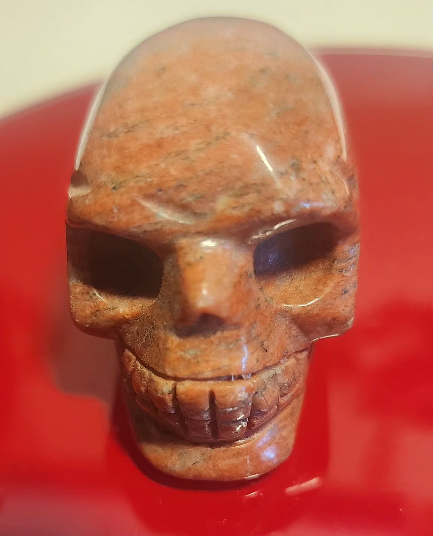 Red Jasper skull carving