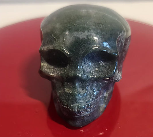 Moss agate skull carvings