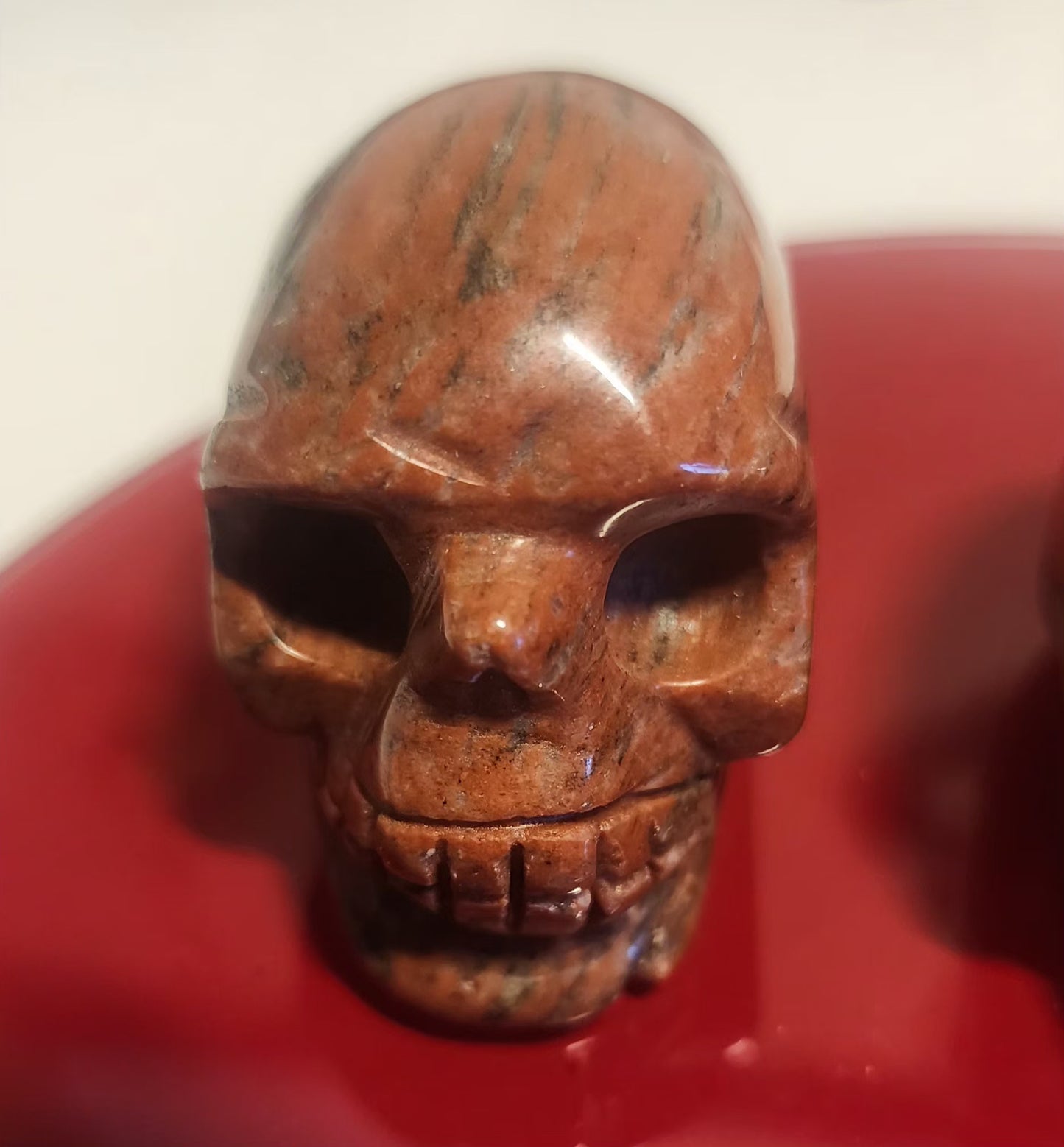 Red Jasper skull carving